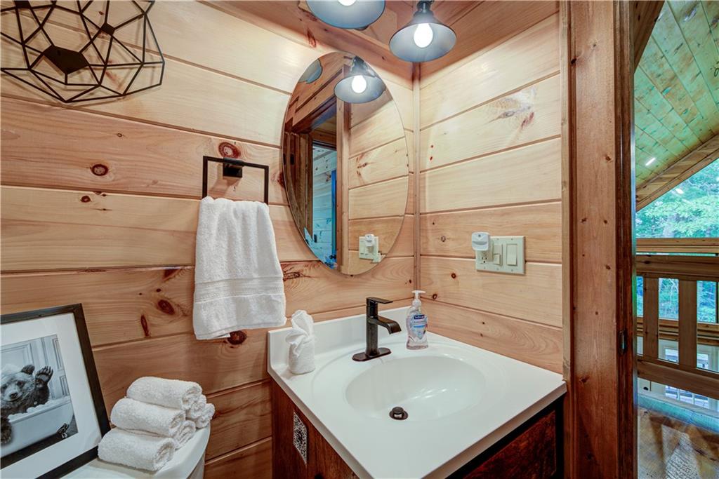 774 Kelly Ridge Drive Blue Ridge, GA 30513 - Photo 10 of 99 a bathroom with a sink vanity and a mirror