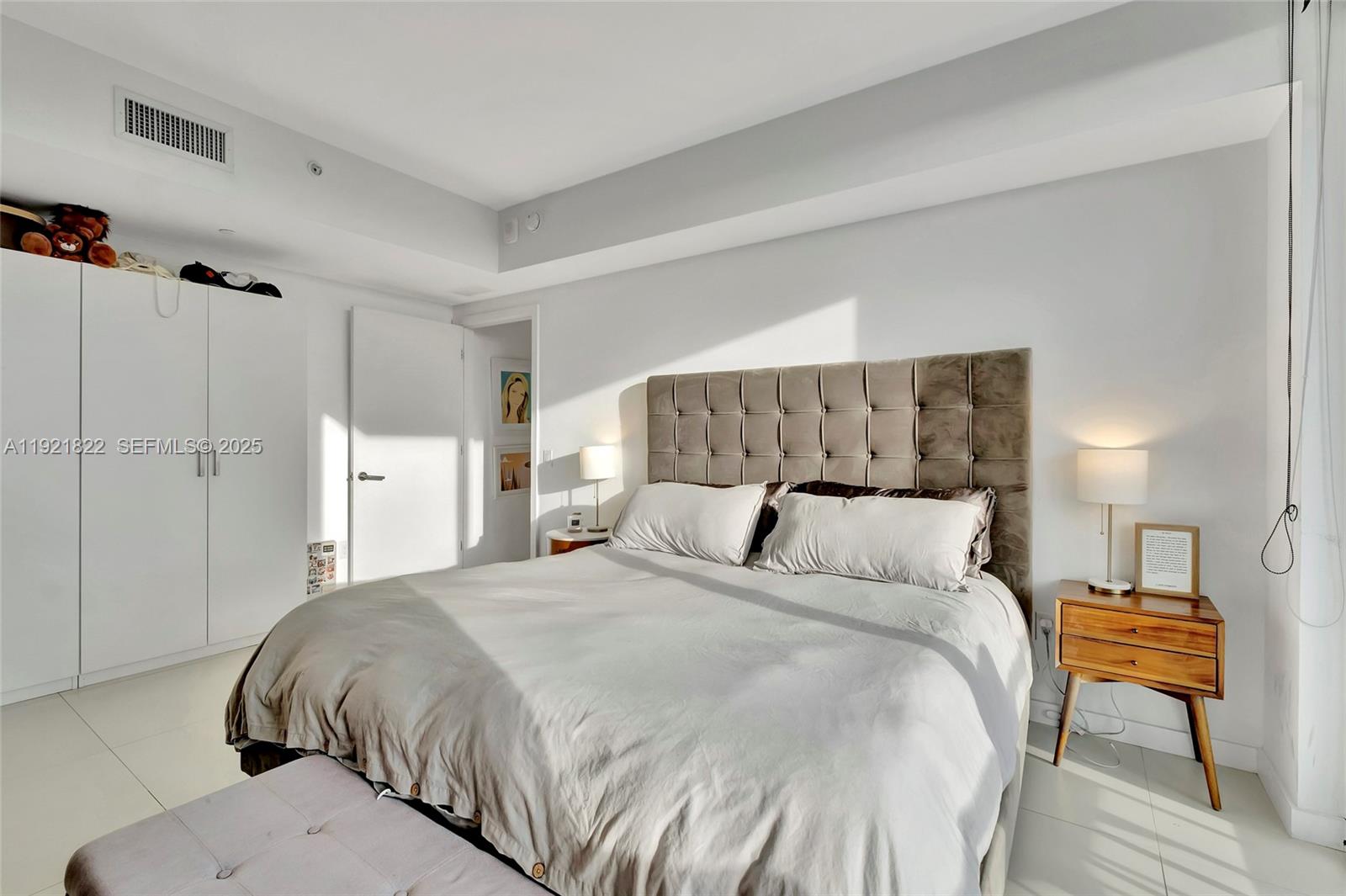 501 Northeast 31st Street, Unit 3708 Miami, FL 33137 - Photo 16 of 31 a large bed sitting in a bedroom and a table