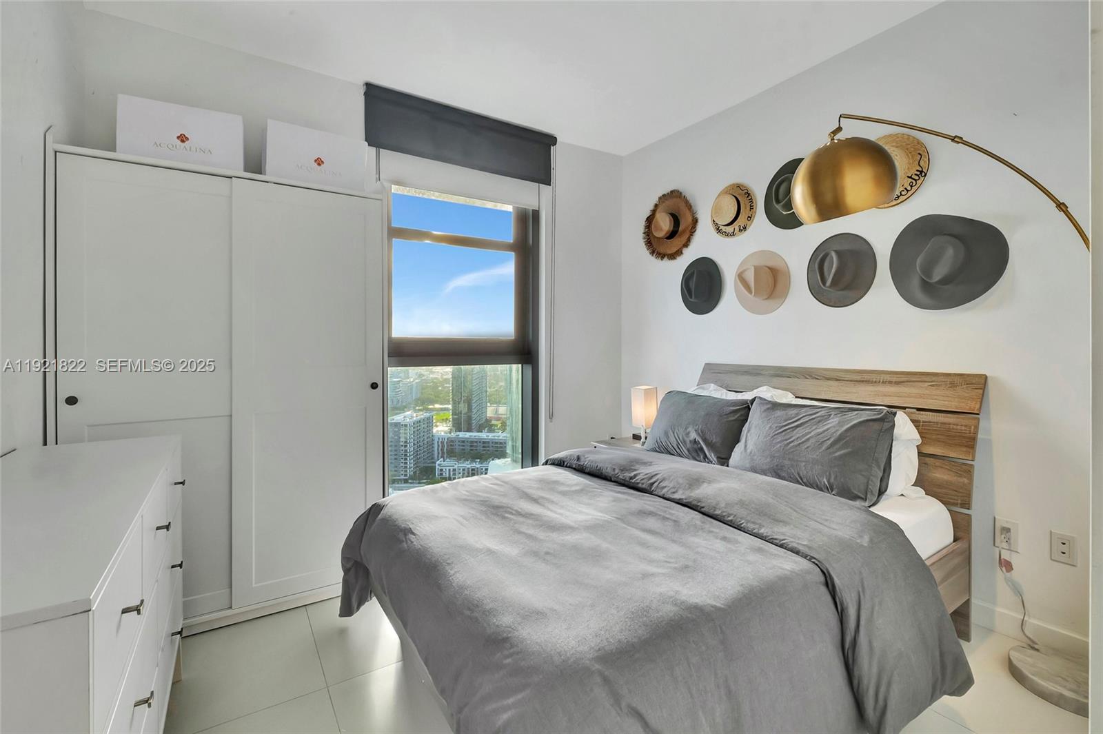 501 Northeast 31st Street, Unit 3708 Miami, FL 33137 - Photo 18 of 31 a bedroom with a bed and a window