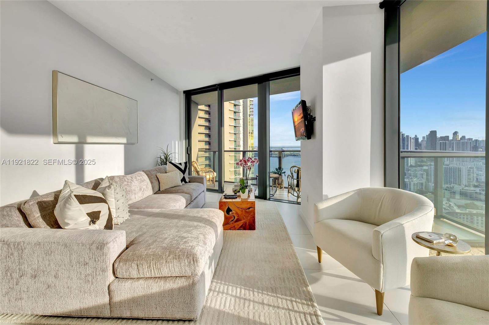 501 Northeast 31st Street, Unit 3708 Miami, FL 33137 - Photo 2 of 31 a living room with furniture and a large window