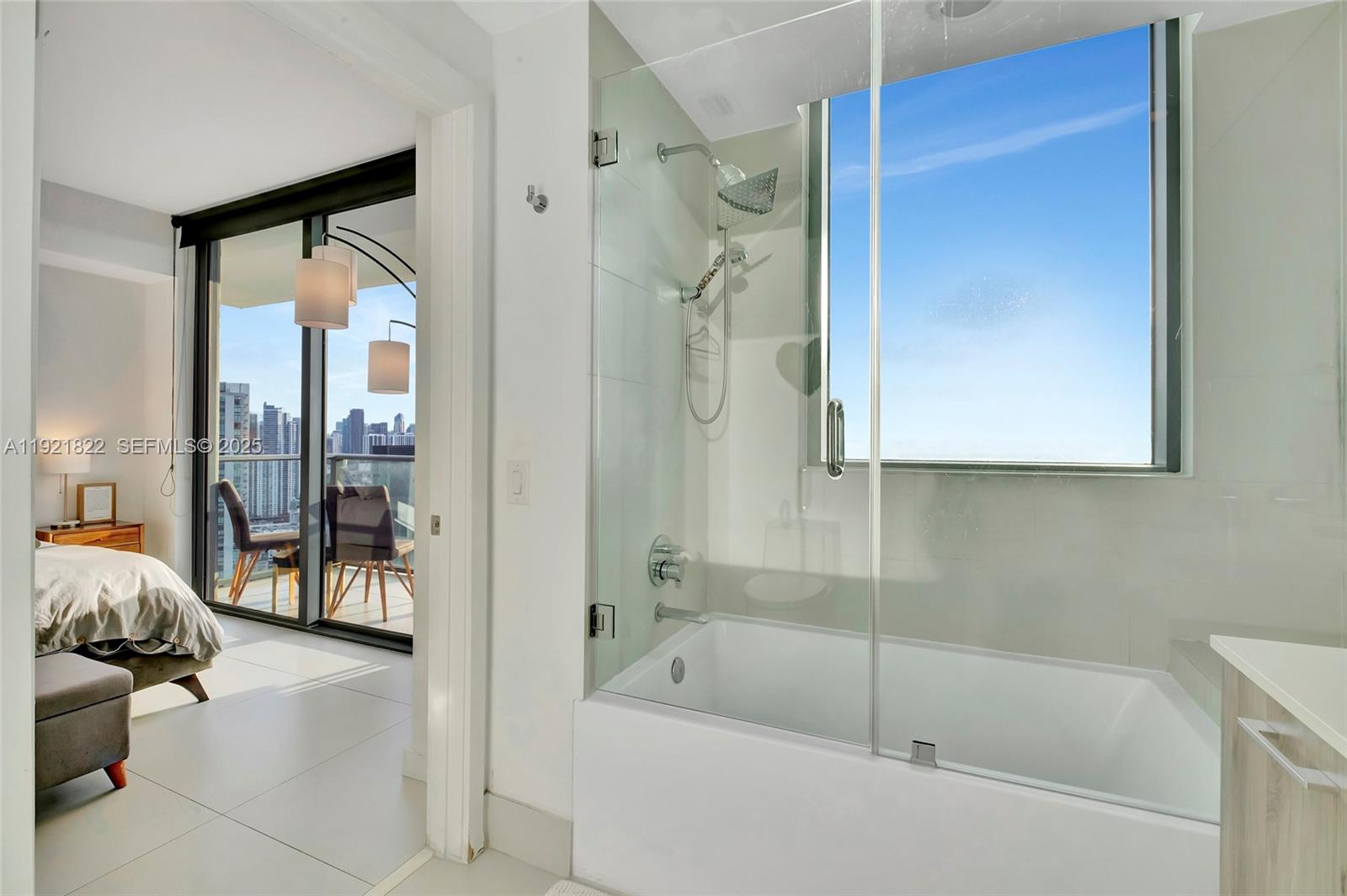 501 Northeast 31st Street, Unit 3708 Miami, FL 33137 - Photo 22 of 31 a bathroom with a tub and shower