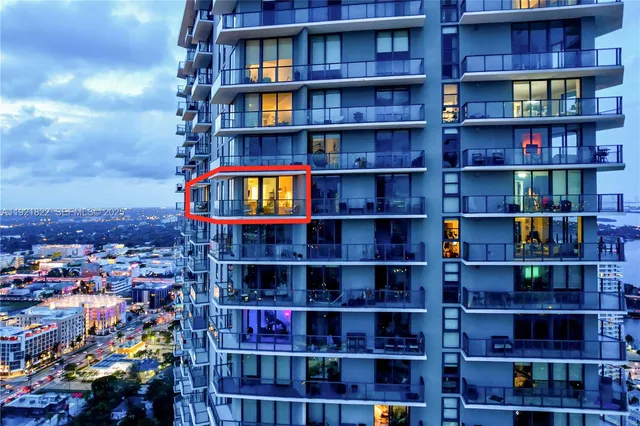 a view of a room with lots of books and racks