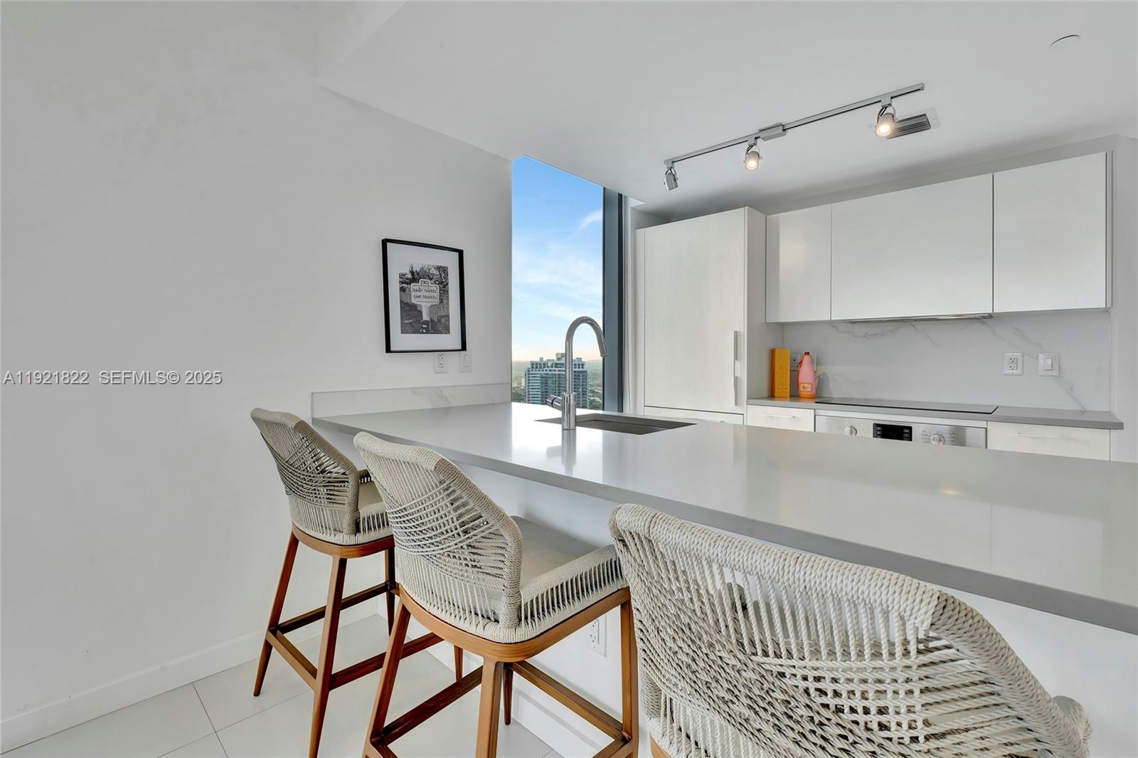 501 Northeast 31st Street, Unit 3708 Miami, FL 33137 - Photo 6 of 31 a kitchen with a dining table and chairs