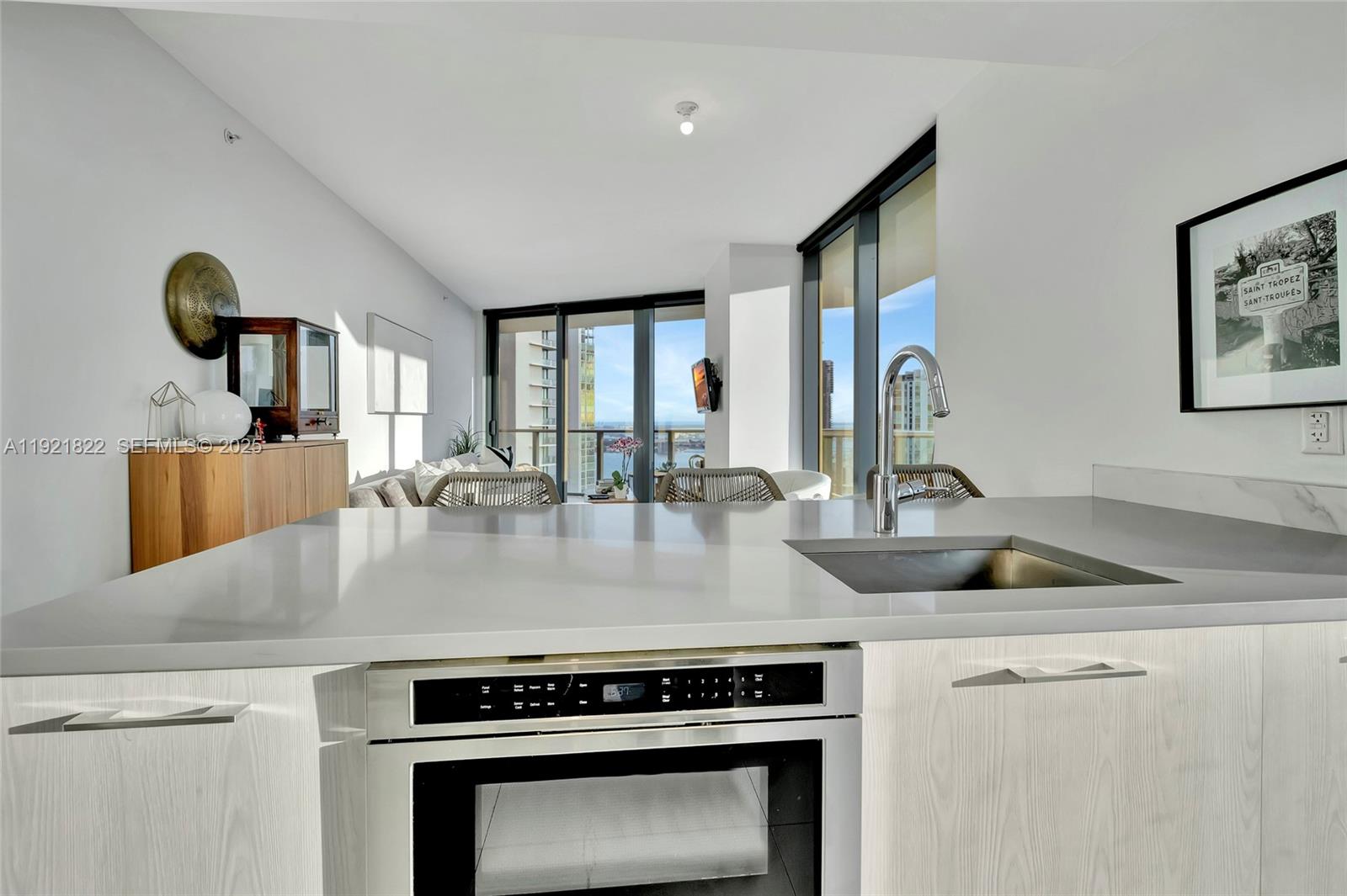 501 Northeast 31st Street, Unit 3708 Miami, FL 33137 - Photo 7 of 31 a kitchen with a stove and a sink