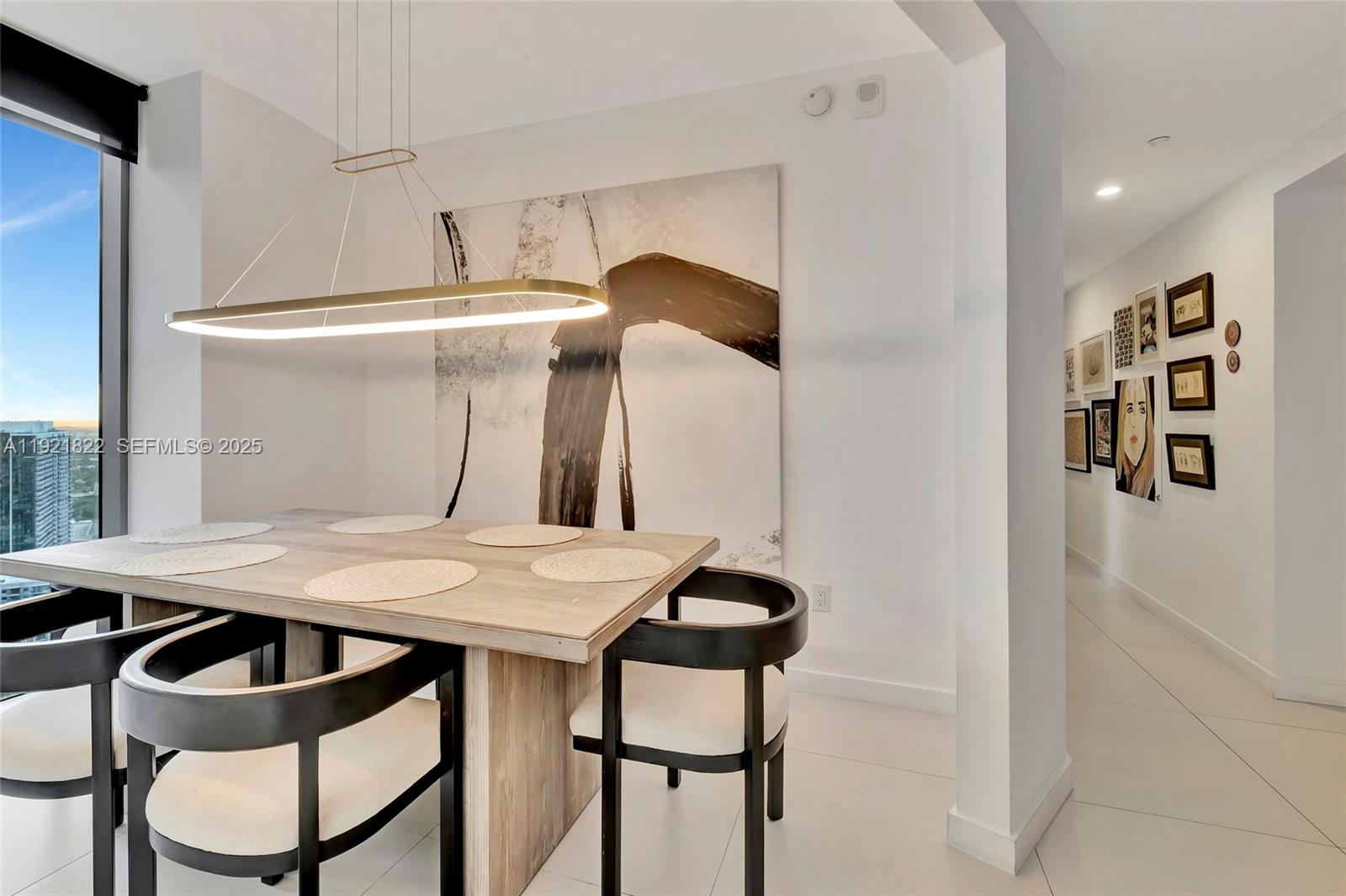 501 Northeast 31st Street, Unit 3708 Miami, FL 33137 - Photo 10 of 31 a table and chairs in a kitchen