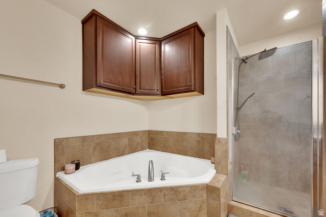 2026 Cres Drive South Mapleton, UT 84664 - Photo 9 of 18 Bathroom with a stall shower, a bath, and recessed lighting