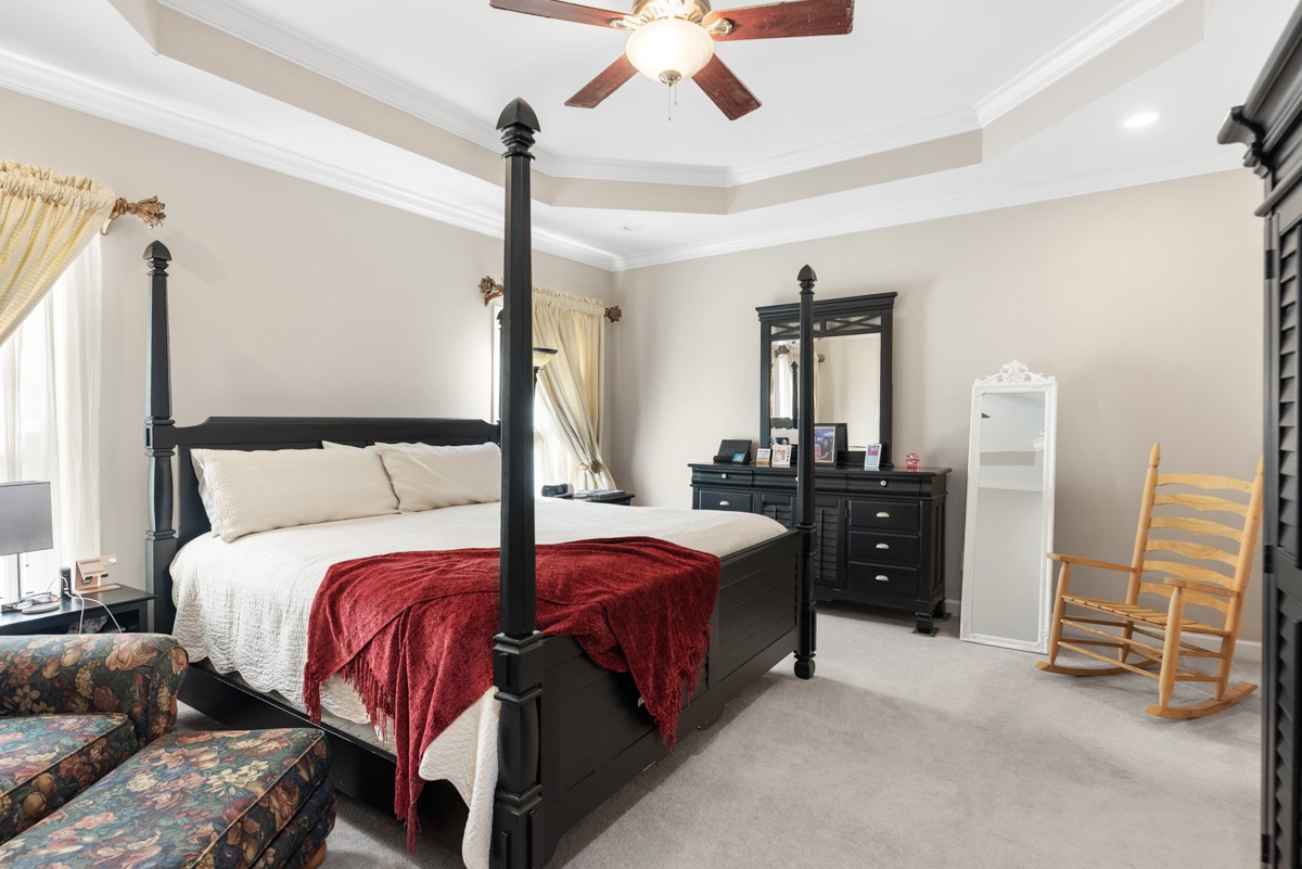 105 Robin Point Gallatin, TN 37066 - Photo 27 of 59 a bedroom with a bed and a chandelier