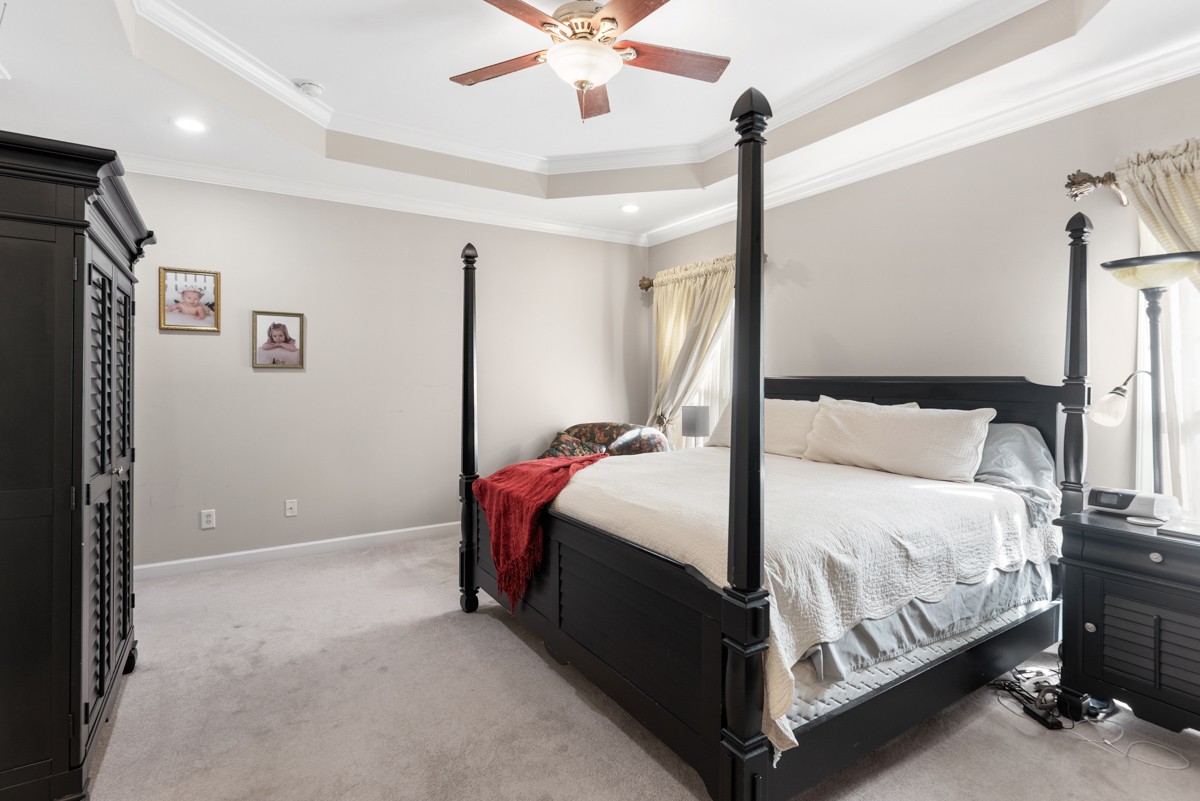 105 Robin Point Gallatin, TN 37066 - Photo 28 of 59 a bed room with a bed and a ceiling fan