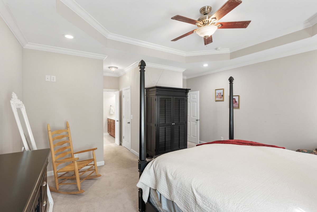 105 Robin Point Gallatin, TN 37066 - Photo 29 of 59 a bedroom with a bed and a chandelier