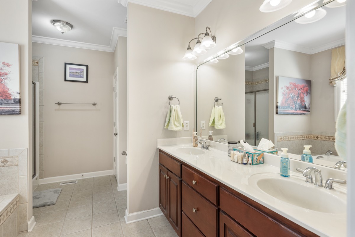 105 Robin Point Gallatin, TN 37066 - Photo 31 of 59 a bathroom with a double vanity sink mirror and