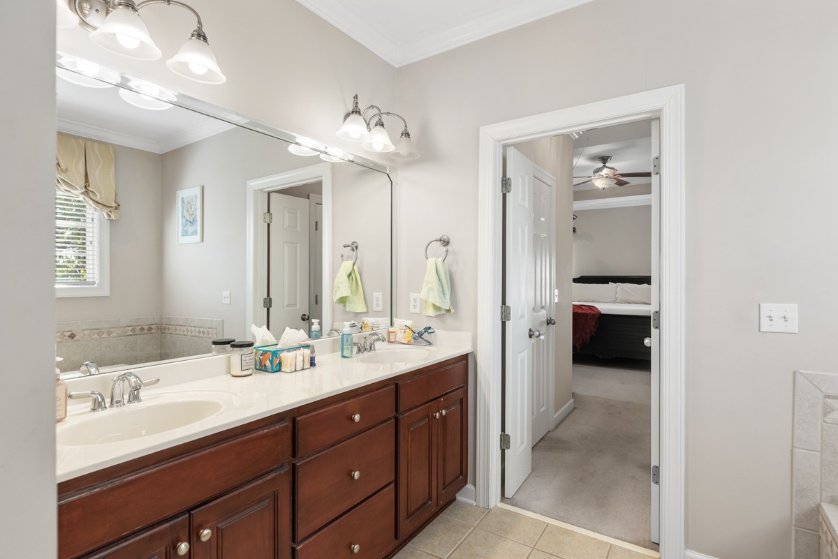 105 Robin Point Gallatin, TN 37066 - Photo 32 of 59 a en suite bathroom with a double vanity sink and a mirror