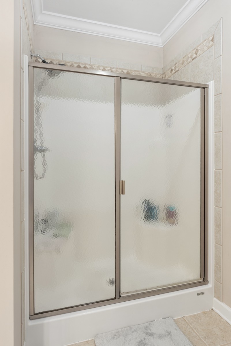 105 Robin Point Gallatin, TN 37066 - Photo 34 of 59 a bathroom with a glass shower door