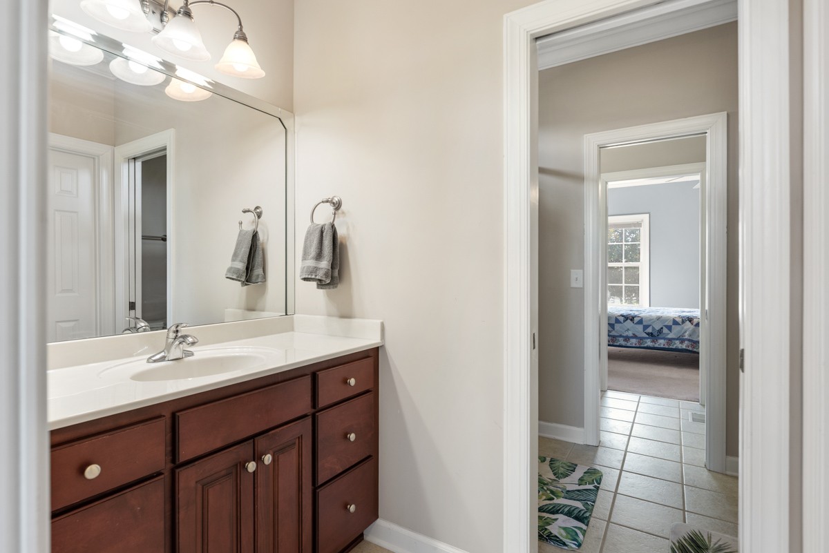 105 Robin Point Gallatin, TN 37066 - Photo 37 of 59 a bathroom with a sink a light fixture and a mirror