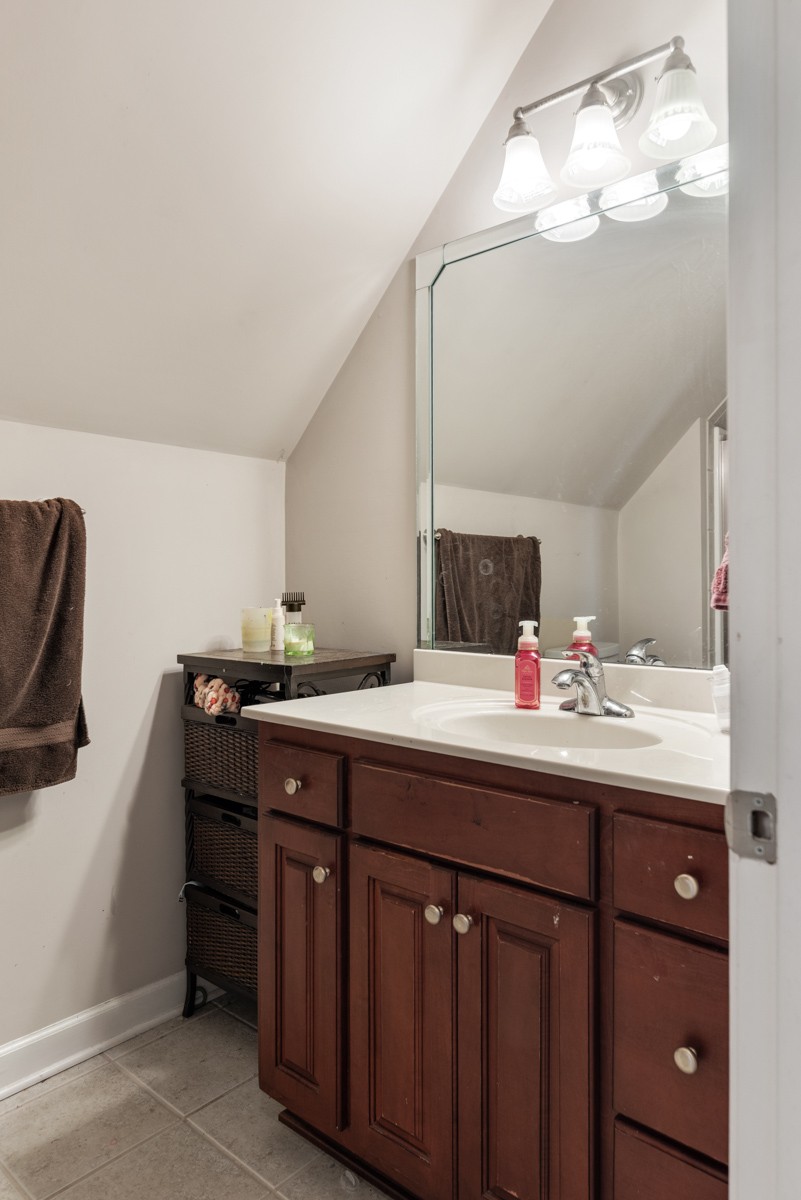 105 Robin Point Gallatin, TN 37066 - Photo 44 of 59 a bathroom with a double vanity sink and a mirror