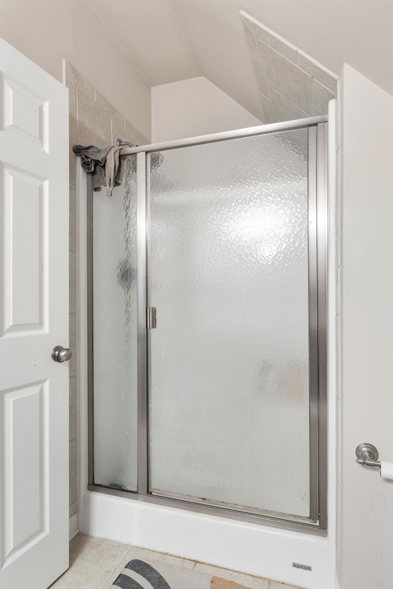 105 Robin Point Gallatin, TN 37066 - Photo 45 of 59 a bathroom with a glass shower door