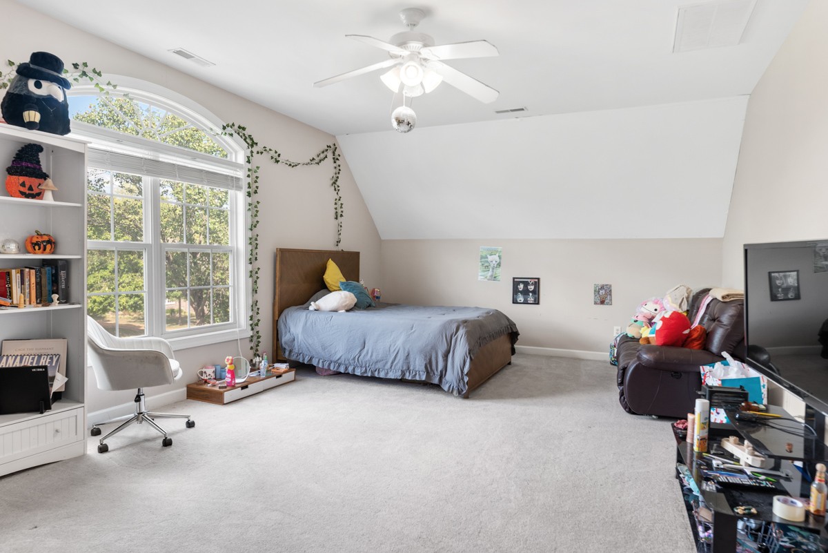 105 Robin Point Gallatin, TN 37066 - Photo 46 of 59 a bedroom with furniture a bed and a chandelier