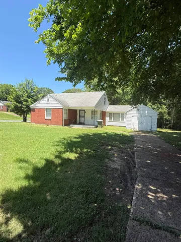 a house view with a garden space