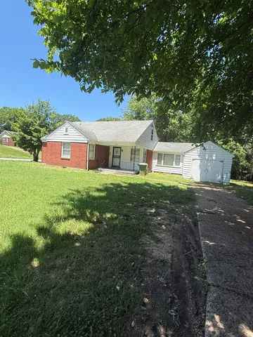 a house view with a garden space