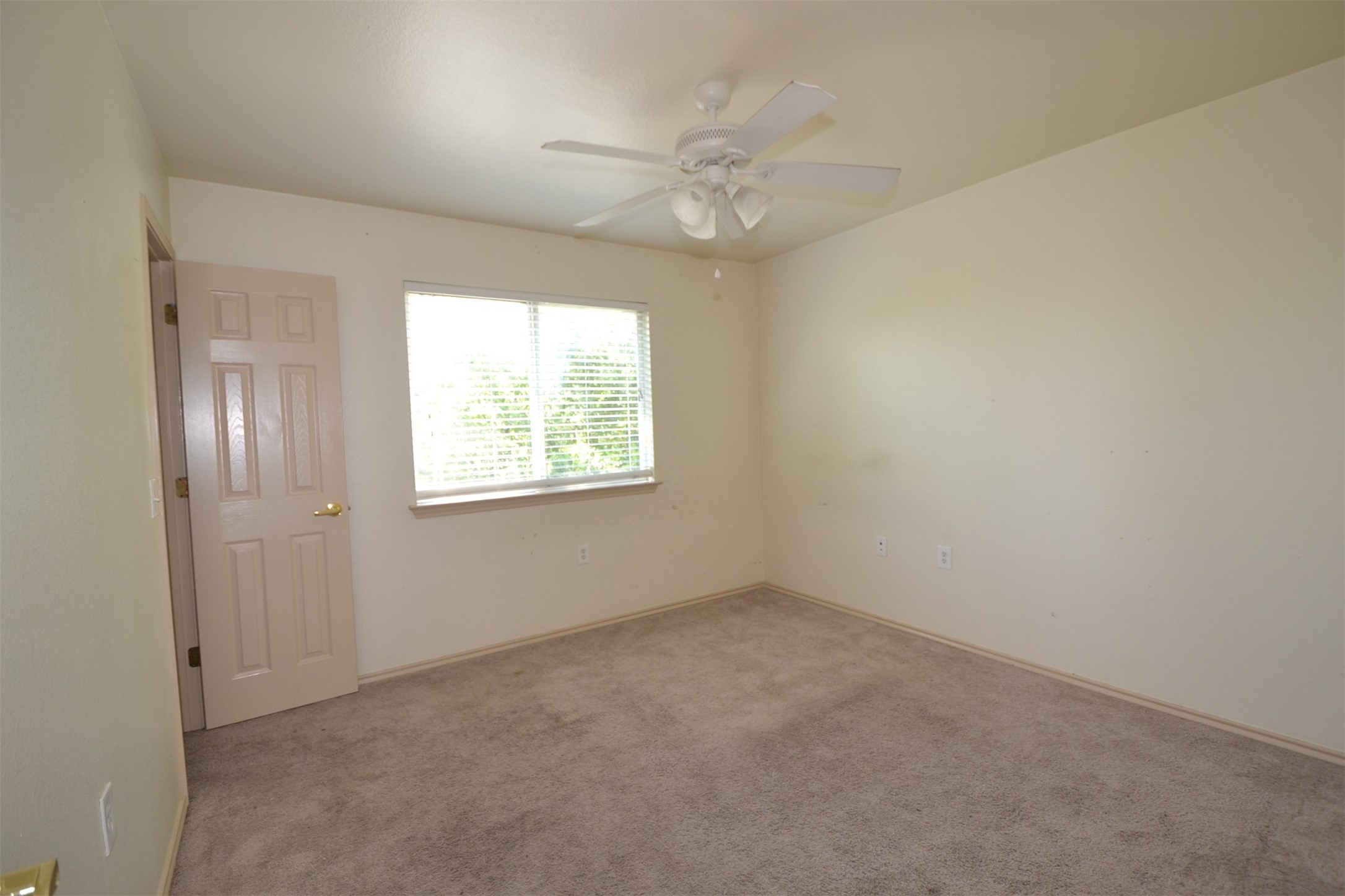 6912 Meador Avenue, Unit A Austin, TX 78752 - Photo 14 of 22 Empty room with carpet floors and ceiling fan