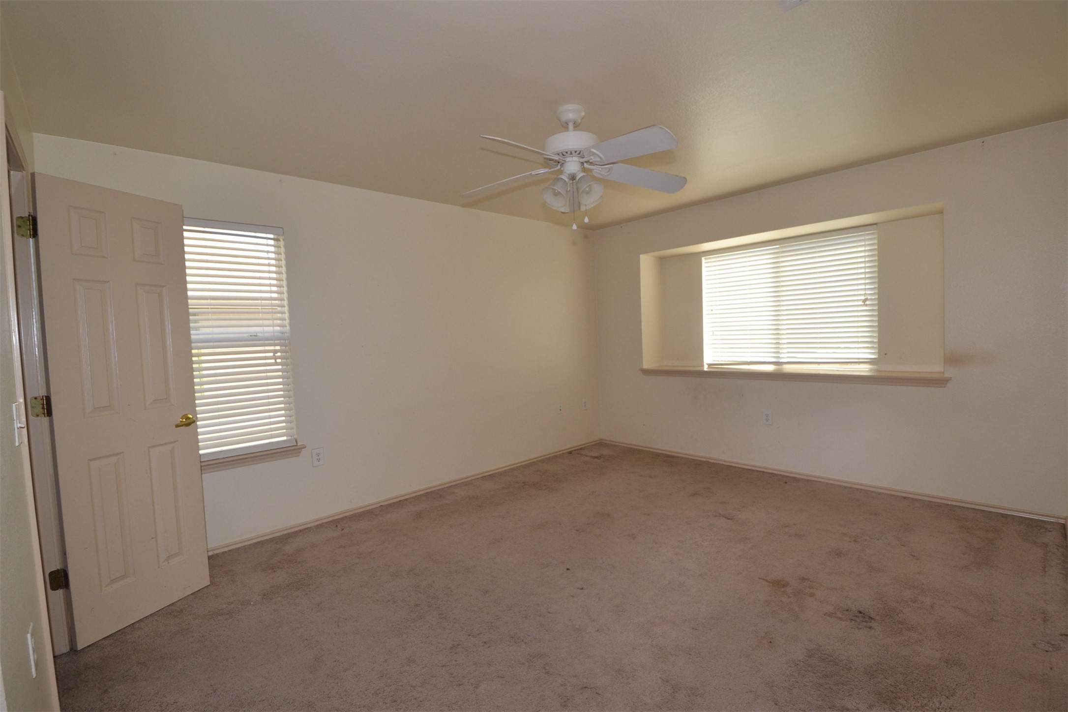 6912 Meador Avenue, Unit A Austin, TX 78752 - Photo 8 of 22 Carpeted spare room with a ceiling fan and plenty of natural light