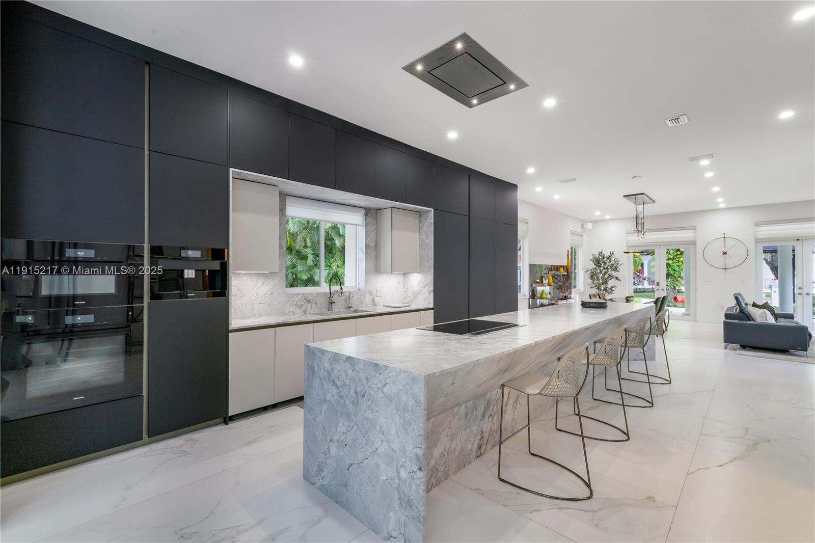 8941 Southwest 65th Court, Unit 8941 Pinecrest, FL 33156 - Photo 12 of 85 a kitchen with stainless steel appliances granite countertop a refrigerator and a sink