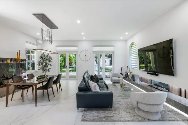 a spacious bedroom with a bed and large windows