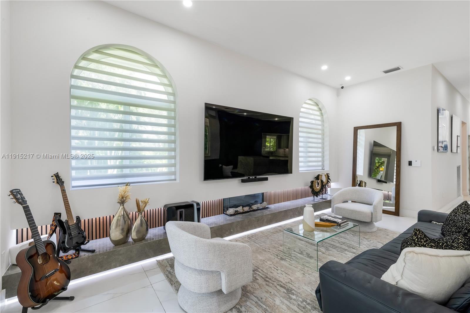 8941 Southwest 65th Court, Unit 8941 Pinecrest, FL 33156 - Photo 19 of 85 a living room with furniture and a flat screen tv