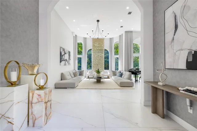 a view of a house with a yard and potted plants