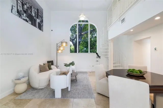 a building outdoor space with patio furniture and garden