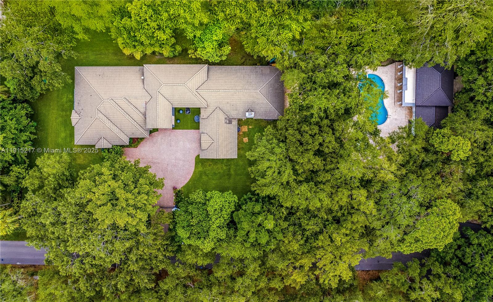 8941 Southwest 65th Court, Unit 8941 Pinecrest, FL 33156 - Photo 50 of 85 an aerial view of a house with a yard