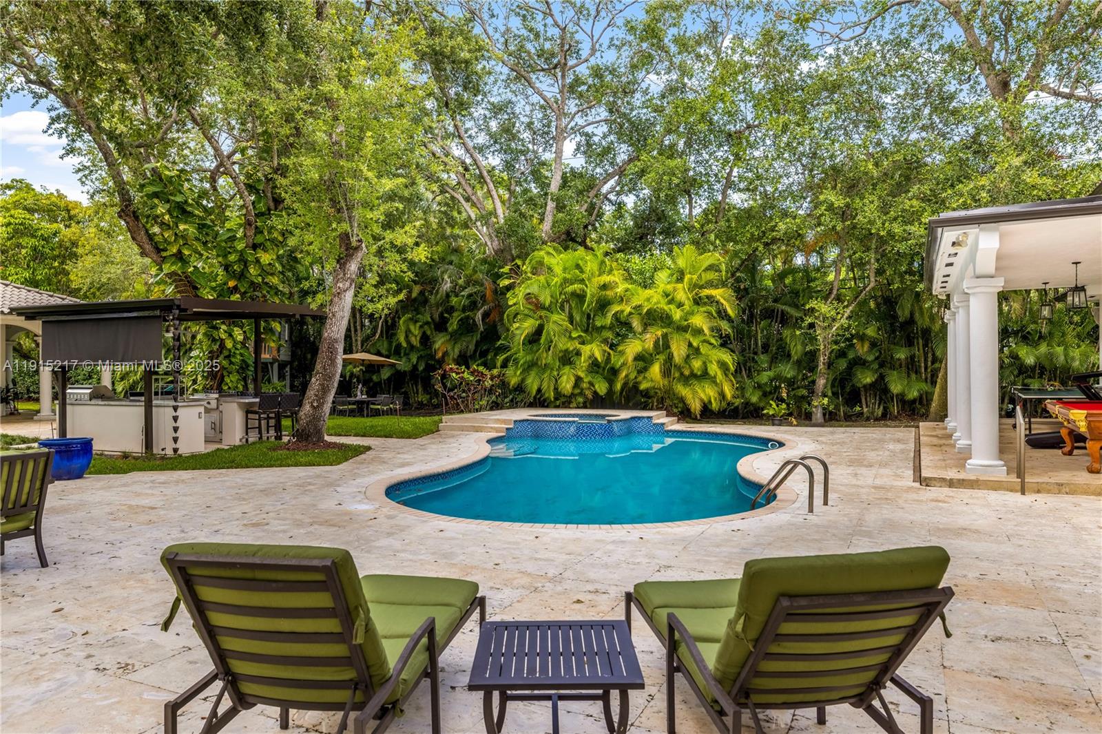 8941 Southwest 65th Court, Unit 8941 Pinecrest, FL 33156 - Photo 53 of 85 a view of a chairs and table in the patio