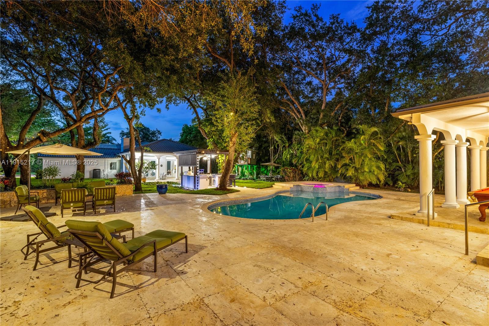 8941 Southwest 65th Court, Unit 8941 Pinecrest, FL 33156 - Photo 76 of 85 a view of a house with swimming pool and sitting area