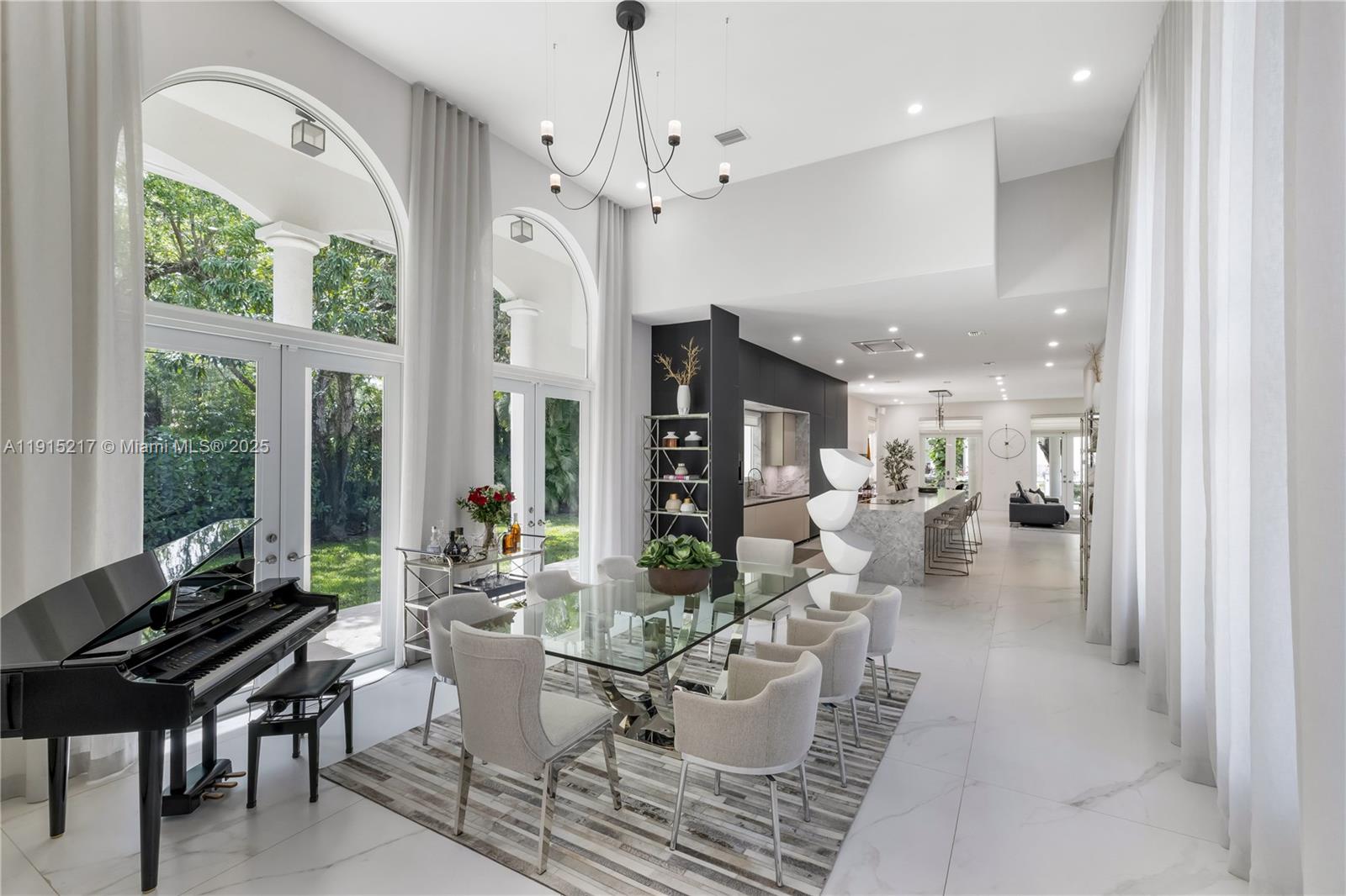 8941 Southwest 65th Court, Unit 8941 Pinecrest, FL 33156 - Photo 8 of 85 a living room with fireplace furniture and a large window