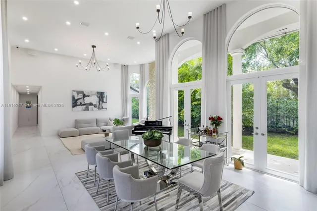 a view of a hallway with a couch and a refrigerator