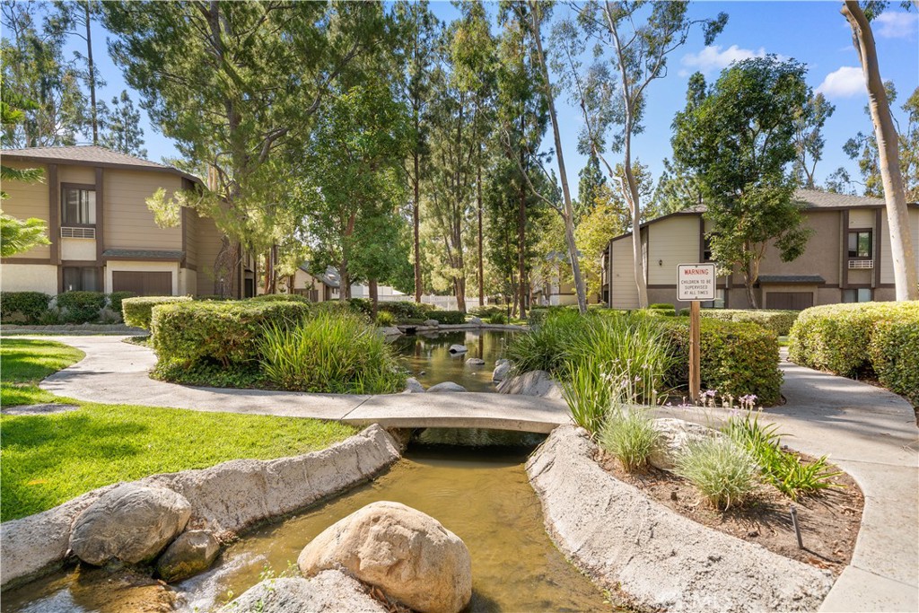 20702 El Toro Road, Unit 325 Lake Forest, CA 92630 - Photo 12 of 15 a view of a swimming pool with a patio