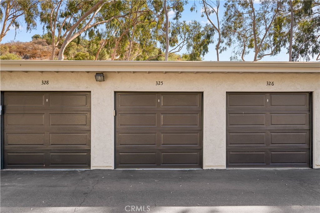 20702 El Toro Road, Unit 325 Lake Forest, CA 92630 - Photo 14 of 15 a view of house with garage