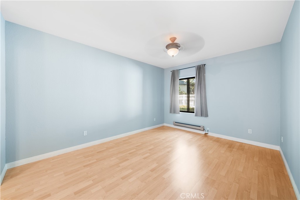 20702 El Toro Road, Unit 325 Lake Forest, CA 92630 - Photo 3 of 15 a view of an empty room with wooden floor and a window