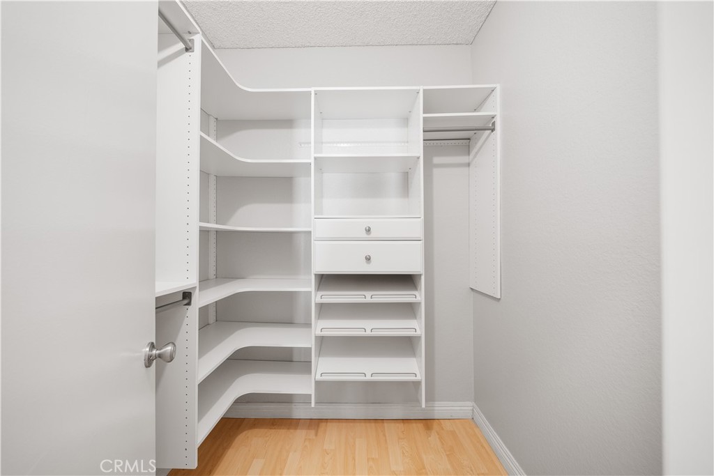 20702 El Toro Road, Unit 325 Lake Forest, CA 92630 - Photo 5 of 15 a view of walk in closet with empty racks
