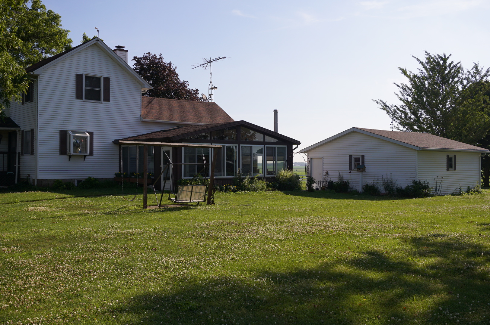 1924 East 6000th Road South St. Anne, IL 60964 - Photo 2 of 35 a front view of a house with a yard and garage