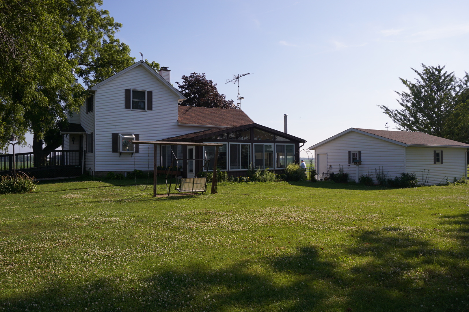 1924 East 6000th Road South St. Anne, IL 60964 - Photo 3 of 35 a front view of house with a garden and trees