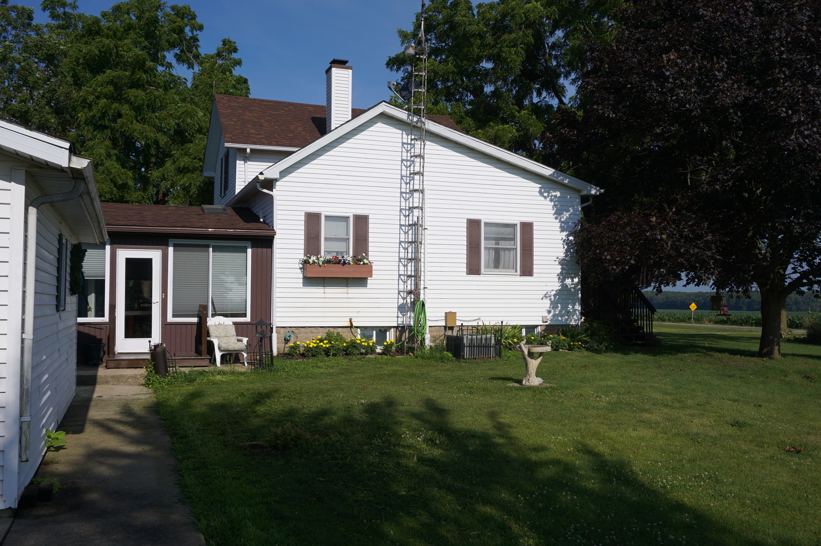 1924 East 6000th Road South St. Anne, IL 60964 - Photo 26 of 35 a view of an house with backyard space and garden