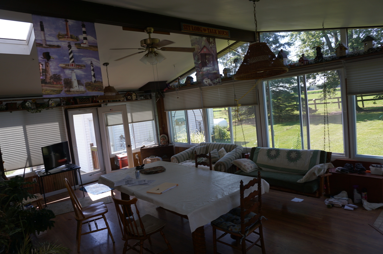 1924 East 6000th Road South St. Anne, IL 60964 - Photo 33 of 35 a living room with furniture a flat screen tv and a large window