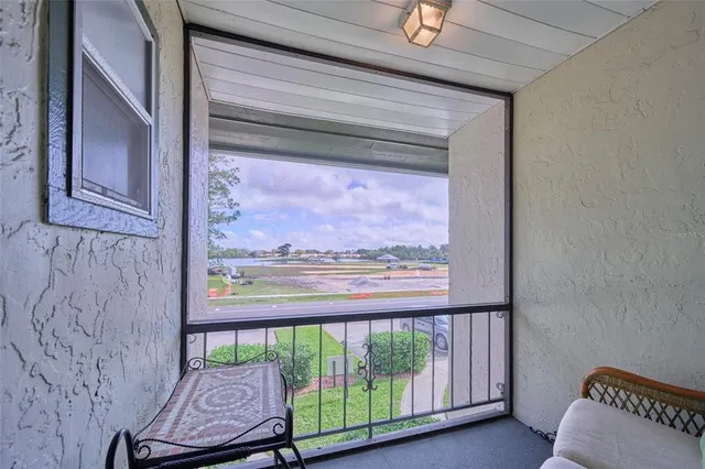 a view of a room with a large window
