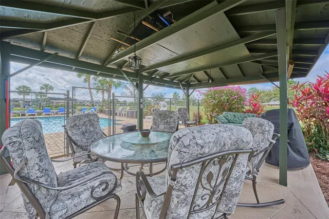a view of a chairs and tables in patio