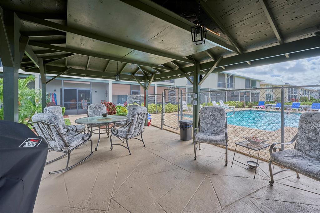 3647 Edgewater Drive Sebring, FL 33872 - Photo 39 of 54 a view of a chairs and tables in patio