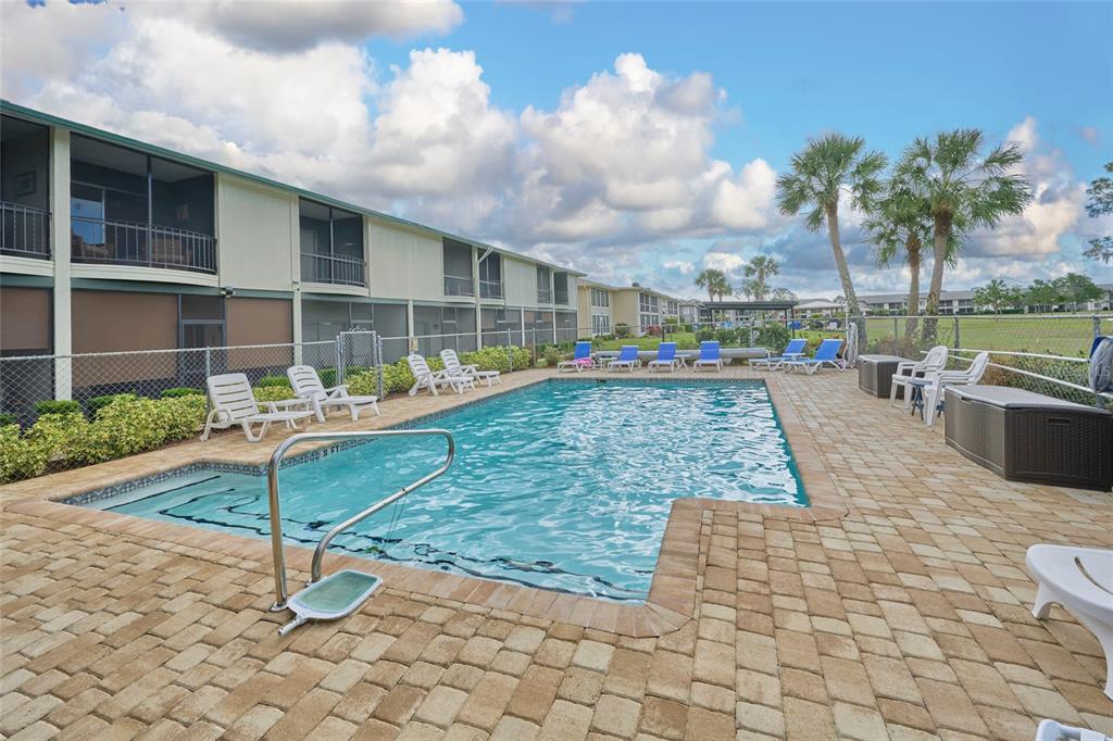 3647 Edgewater Drive Sebring, FL 33872 - Photo 40 of 54 a view of a swimming pool with a porch