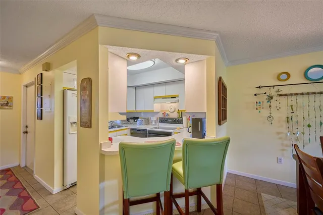 a kitchen with a table and chairs