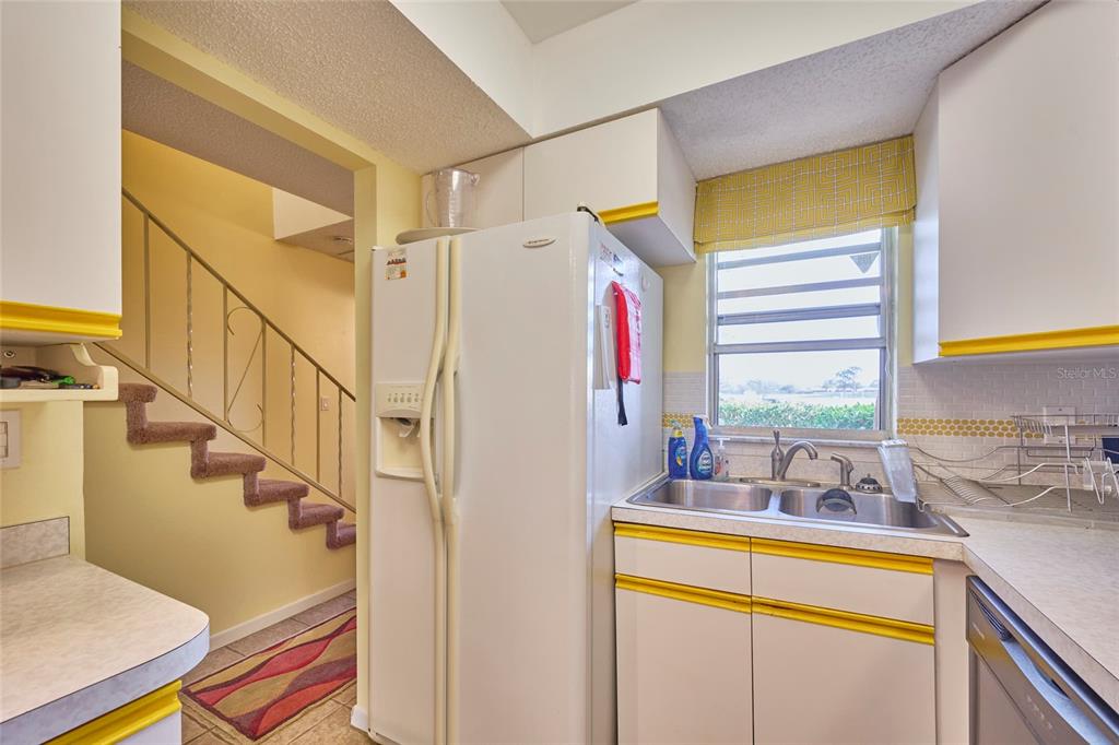 3647 Edgewater Drive Sebring, FL 33872 - Photo 6 of 54 a view of a bedroom with wooden floor and windows