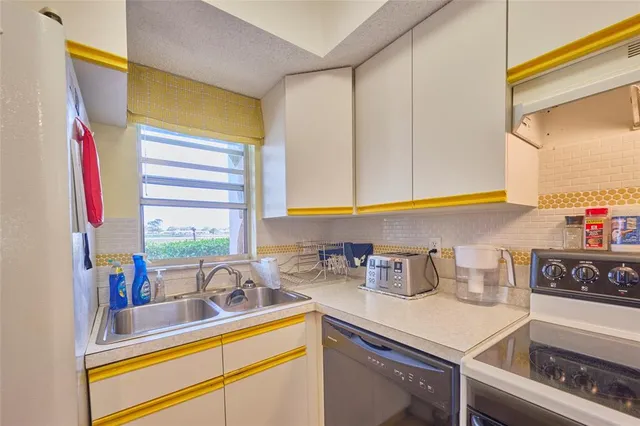a kitchen with sink and window