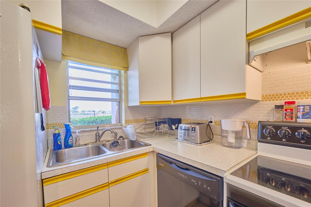 3647 Edgewater Drive Sebring, FL 33872 - Photo 9 of 54 a kitchen with sink and window